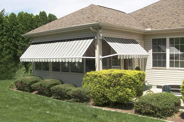 Window awnings that are open on a house